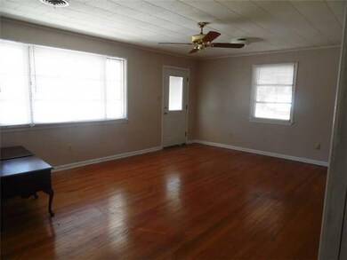Living Room. Real wood floors in this spacious liv
