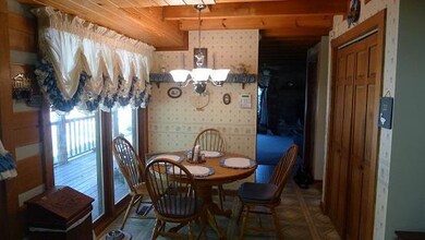 Eating Area In Kitchen Sits Beside Large Windows For A Beautiful View While You Are Eating