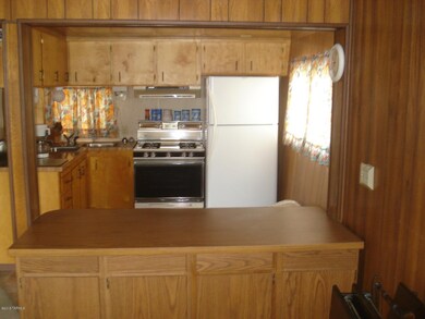 View into kitchen with eating bar