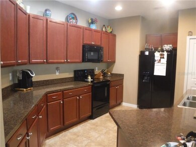 First view of large kitchen with breakfast bar
