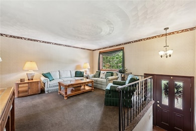 The living room is filled with natural light and l