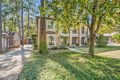 Lovely Magnolia tree in front with an extra long driveway to the 2 car garage in back yard