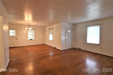 Living Room and view of Dining Room. Still has ori