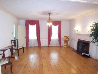 Living Room. Wide Wood Flooring and Elegance