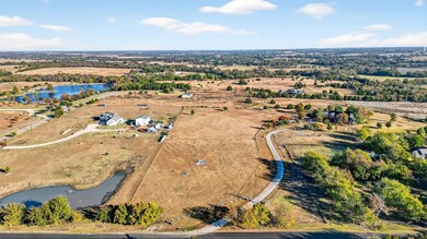 Overview of rural landscape with a nearby body of water
