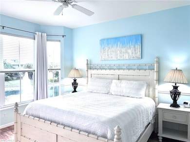 Bedroom with hardwood / wood-style flooring and ce