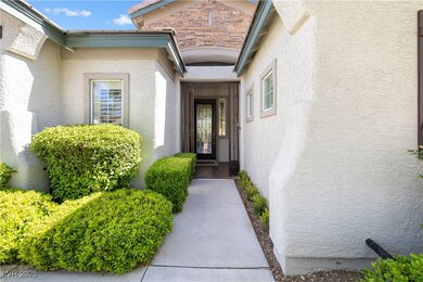 Property entrance with stucco siding and stone sid