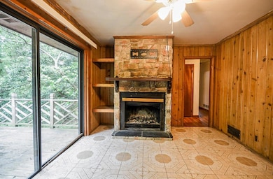 Unfurnished living room with wood walls, ornamenta