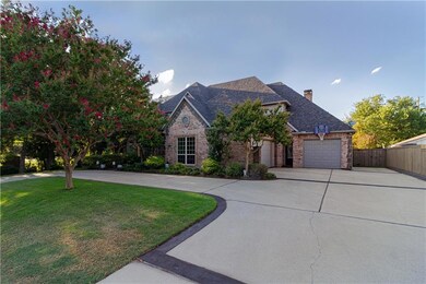 Front showing 3 car garages.