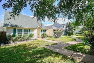 Tranquil walkway to the house with the garage located on the back alley