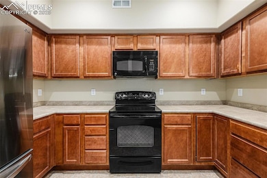 Kitchen with decorative light fixtures, stainless 