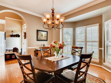 Formal dining with beautiful archway to foyer.