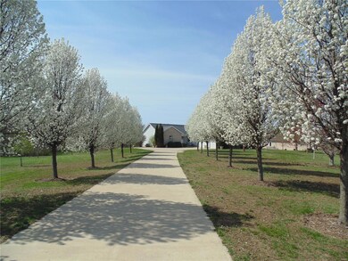 CONCRETE DRIVEWAY LEADING TO 27 X 24 OVER-SIZED GA