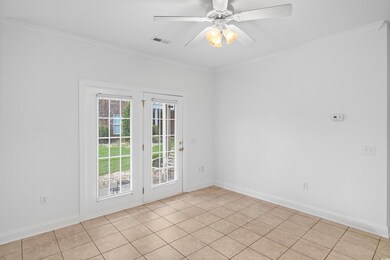 Unfurnished room featuring ceiling fan, ornamental