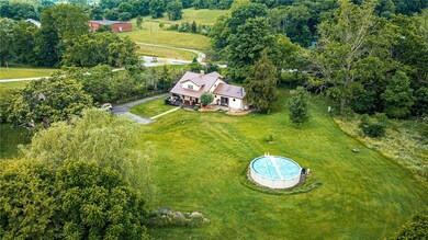 Ample outdoor space and an above ground pool make