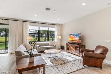 Living Room with Gorgeous Golf Course Views! Impac
