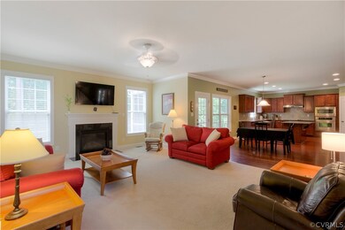 The Family Room is bright and opens into the Kitchen area. It includes a Gas Fireplace and is wired for surround sound.
