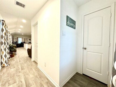 View from the front door with coat closet to the right