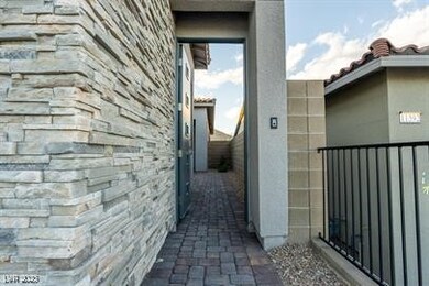 View of side of home featuring stone siding