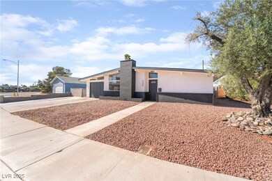 View of front of house with driveway, stucco sidin
