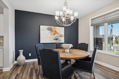 (Photo of a decorated model, actual homes finishes will vary) The formal dining room allows for many guests.