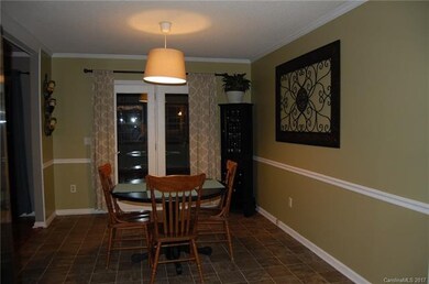 DINING AREA WHICH GOES INTO FAMILY ROOM AND OPEN T