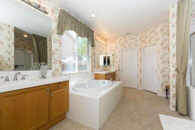 Master bathroom with dual sinks, large soaking tub, separate shower and large walk in closet.
