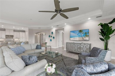 Great Room featuring crown molding, a ceiling fan,