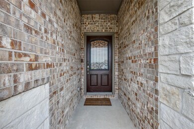 Gorgeous front entry with a leaded glass door to w