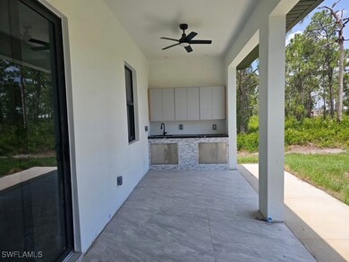 View of patio featuring exterior kitchen and ceili