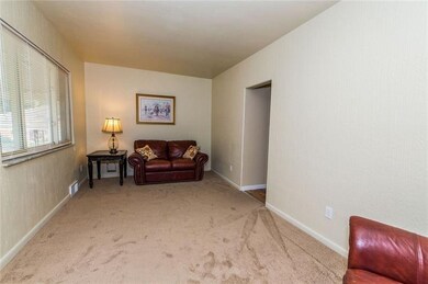 Enjoy time together in the newly carpeted and painted living room.