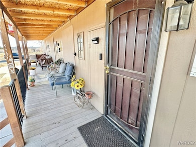 Large covered porch with newer deck.