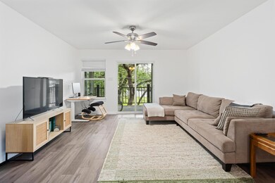 Living area featuring wood finished floors and ce