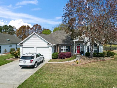 View of front of property with driveway, a front y