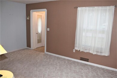 Living Room View 2 and view of Foyer entry.