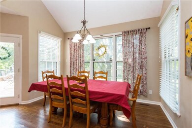 Sunlit breakfast area with access to deck. Eat ins