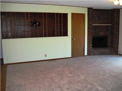 Spacious front room offers cozy fireplace