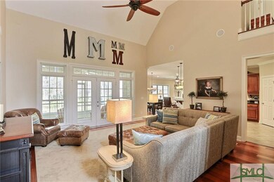 Great Room opens to a breezy screen porch.