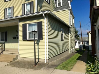 Covered Front Porch, Lightpole and Sidewalk to bac