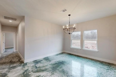 Unfurnished dining area featuring a chandelier, ba