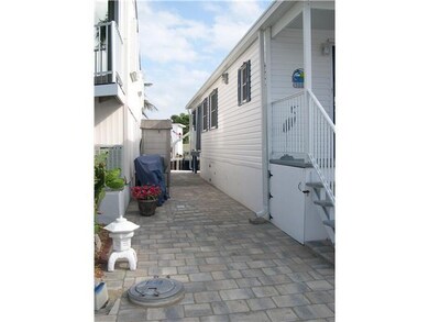 Other. Pavered side yard has designer lighthouse t