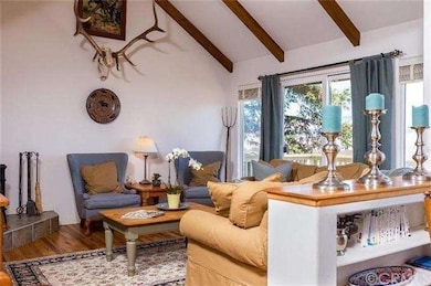 The Family Room features a vaulted beam ceiling, w