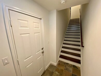 First floor entrance. To the left is the garage. S
