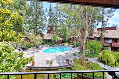 Large balcony with views of the pool, clubhouse, t