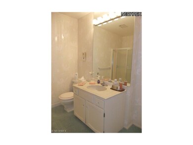 ...and white vanity with cultured sink top.