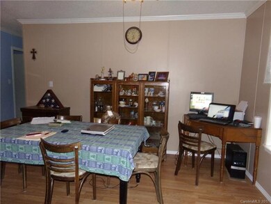 Dining area adjacent to kitchen and living room