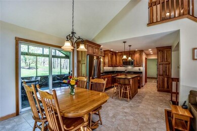 A view of the vaulted dining area open to the kitc