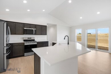 Quartz Countertops and undermount sink with great windows and light