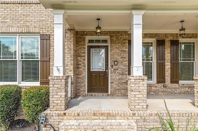 Doorway to property featuring a porch