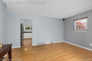 Empty room featuring light wood-style floors